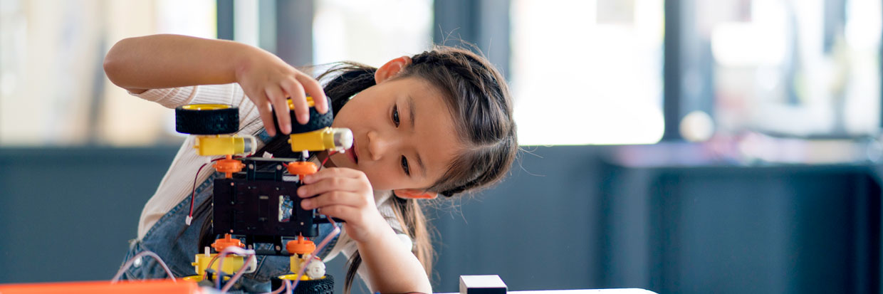 Child working with a robot